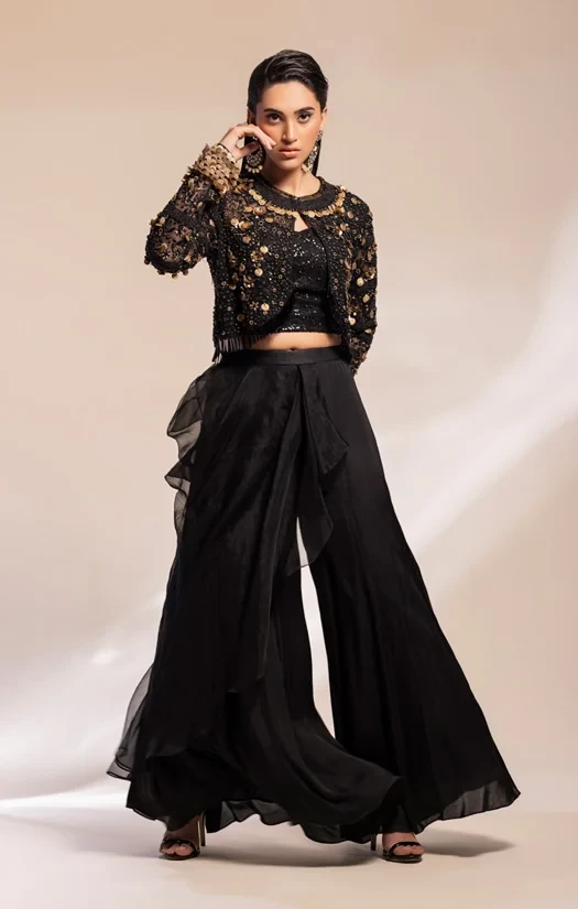 Black embroidery bolero jacket , corset blouse worn with sharara trousers.